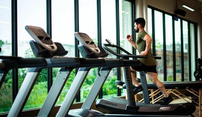 an image of a man running on a treadmill