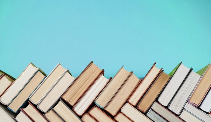 an image of books being placed on top of each other