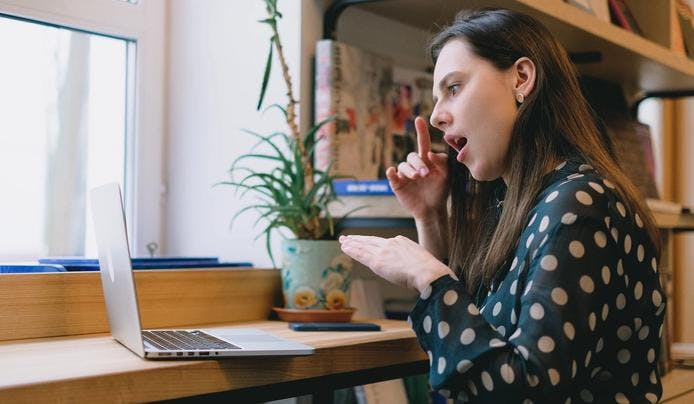 A women discovering something new on her laptop