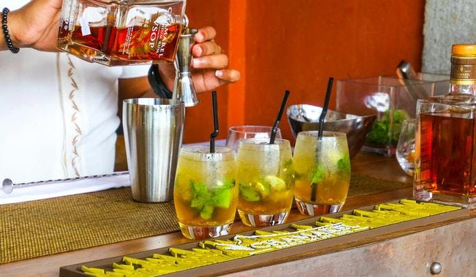 A bartender pouring drinks