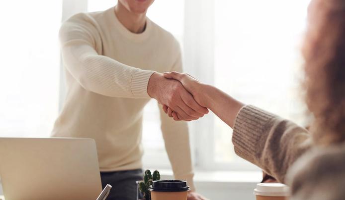 Demonstrating interpersonal intelligence as people shook hands 