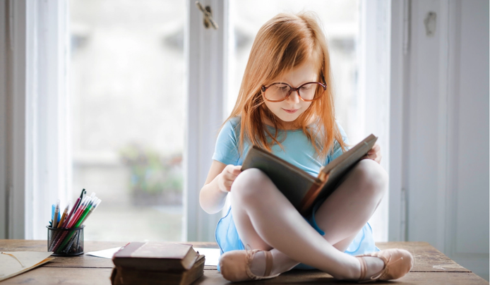 an image of a girl reading about do people with high IQ read faster