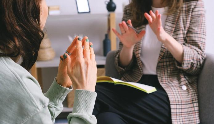 Two people having a conversation to boost mental agility